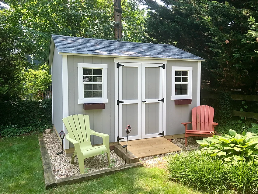 Backyard Shed with a stone patio